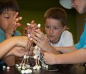 Children building a structure at a science center